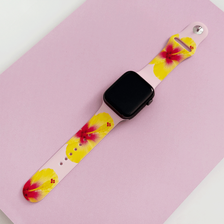 Pink Apple Watch Strap with yellow hibiscus flowers.