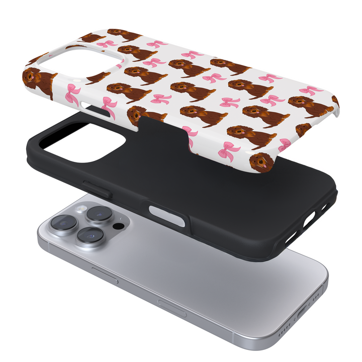 Expanded phone case with dog pattern and pink bows on a white background