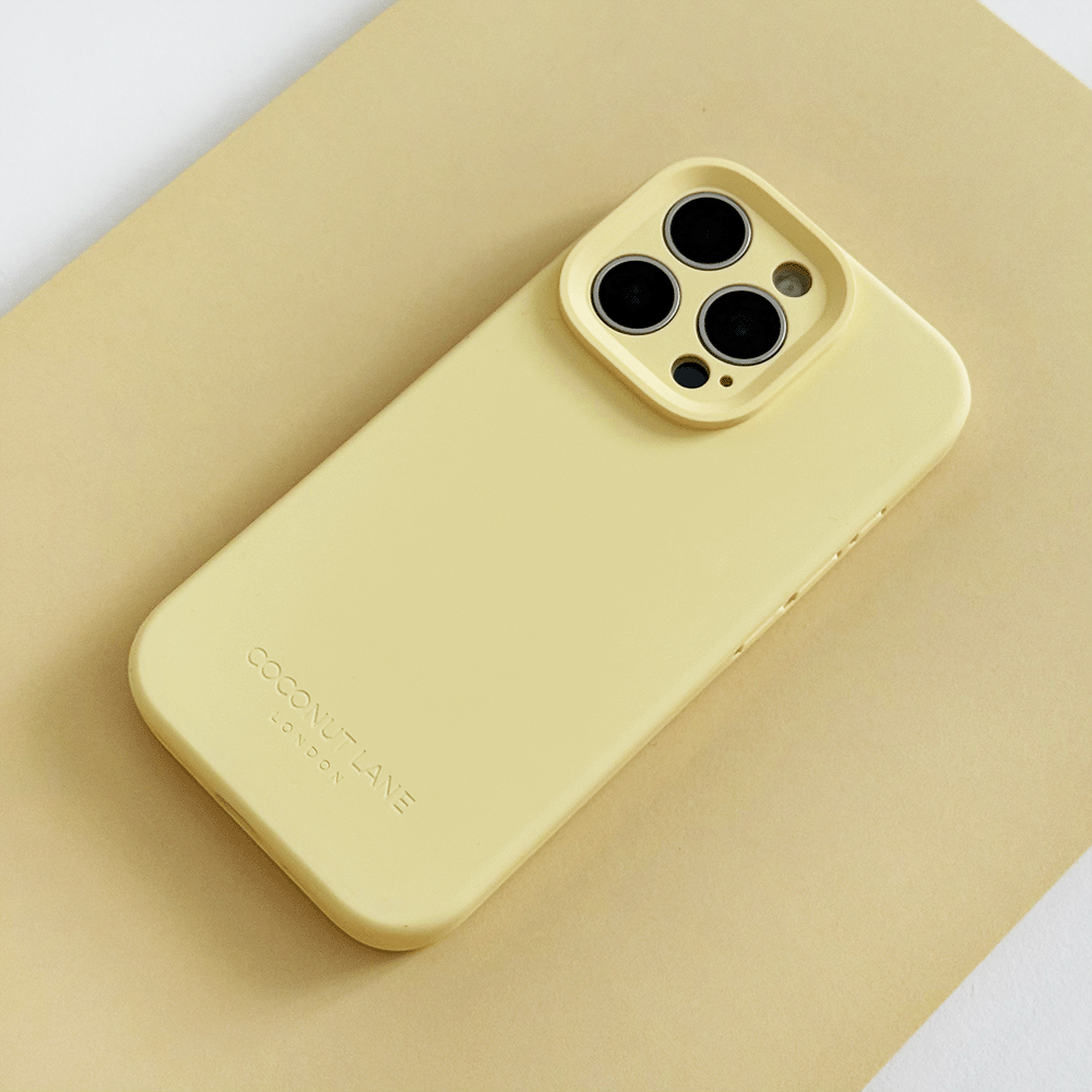 Yellow Phone Case with 'Coconut Lane' branding on a pink background.