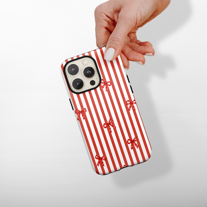Red and white candy cane stripes with red bows.