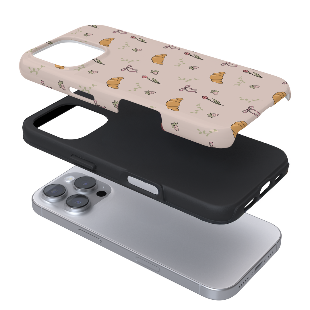 Expanded view of a phone case with a croissant print on a white background