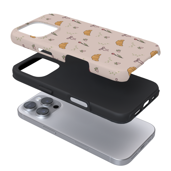 Expanded view of a phone case with a croissant print on a white background