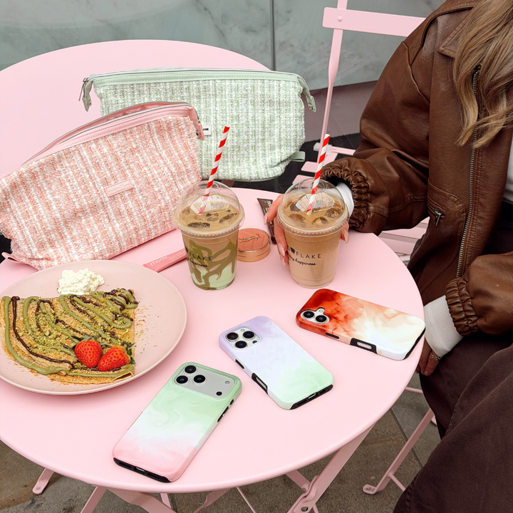 Girl sat on a pink table with cute accessories