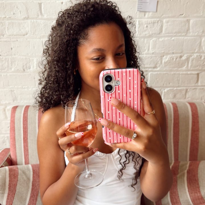 Girl with wine in hand taking selfie with Love Drops Phone Case
