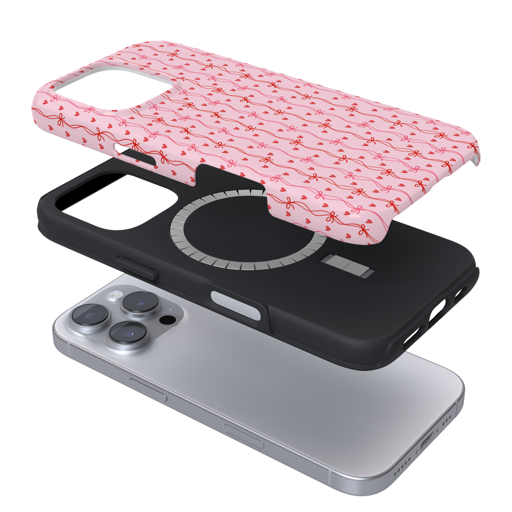 Expanded Magsafe phone case with a pink wavy pattern with bows on a white background