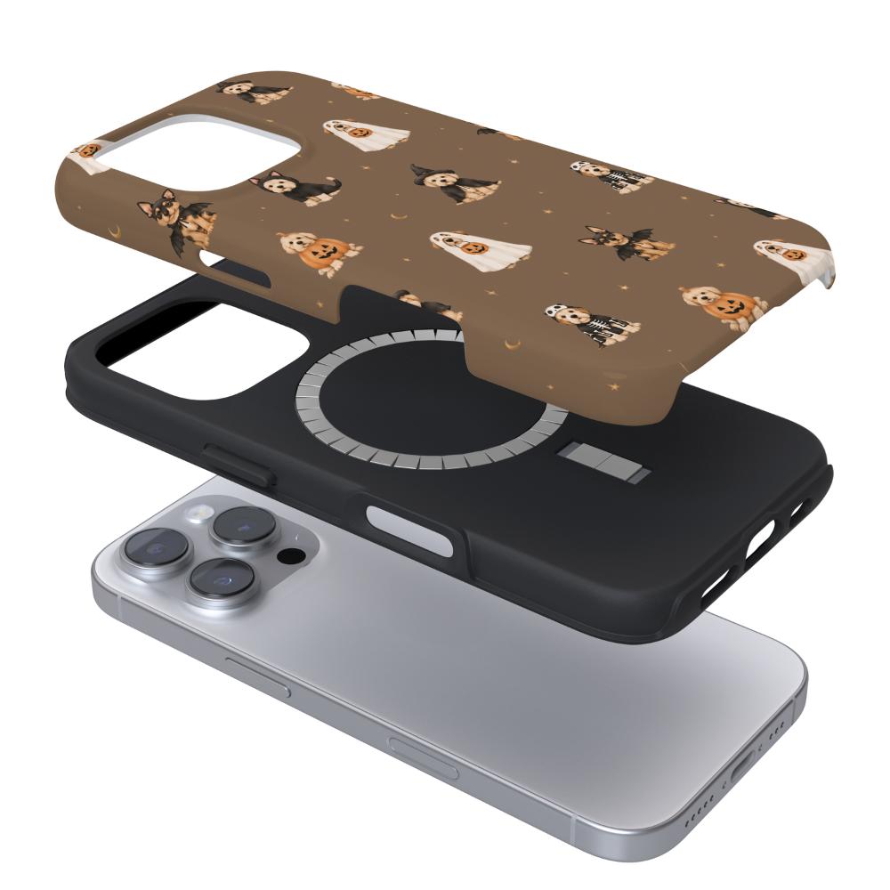 Pups wearing spooky outfits on a brown background.