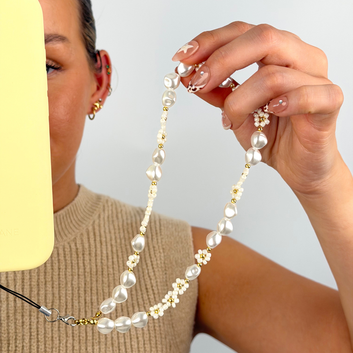 Pearl Core Phone Strap attached to phone case