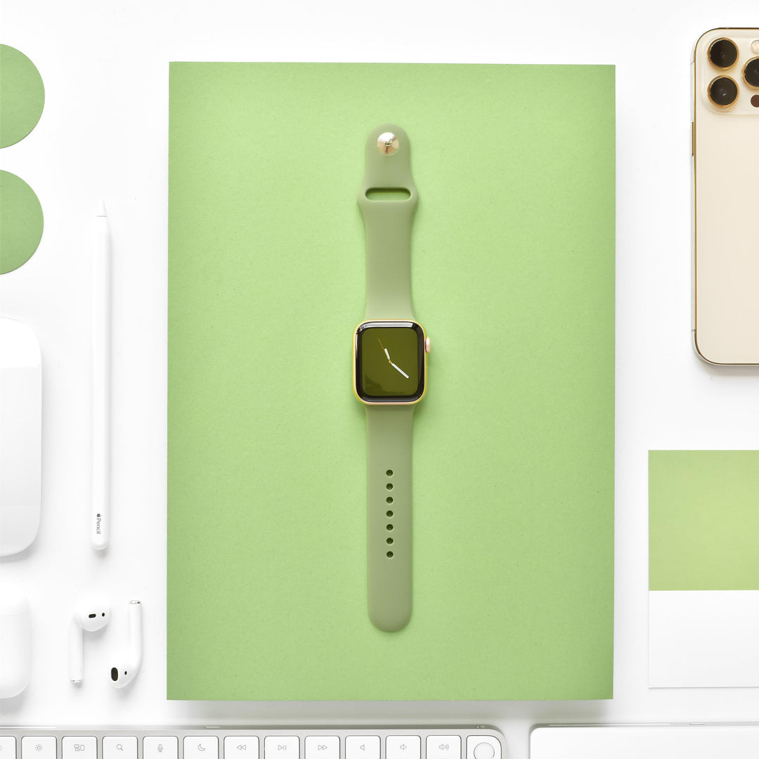 orange-apple-watch-strap-surrounded-by-apple-technology