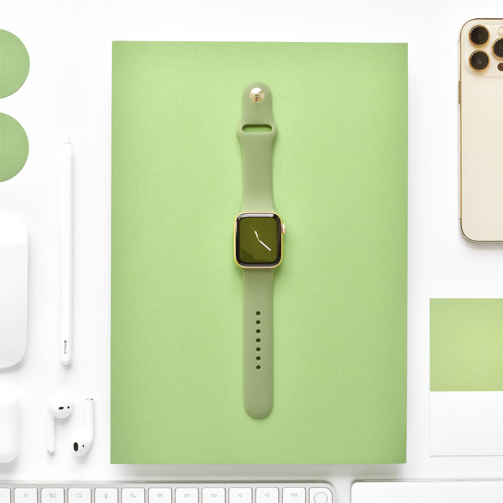 orange-apple-watch-strap-surrounded-by-apple-technology